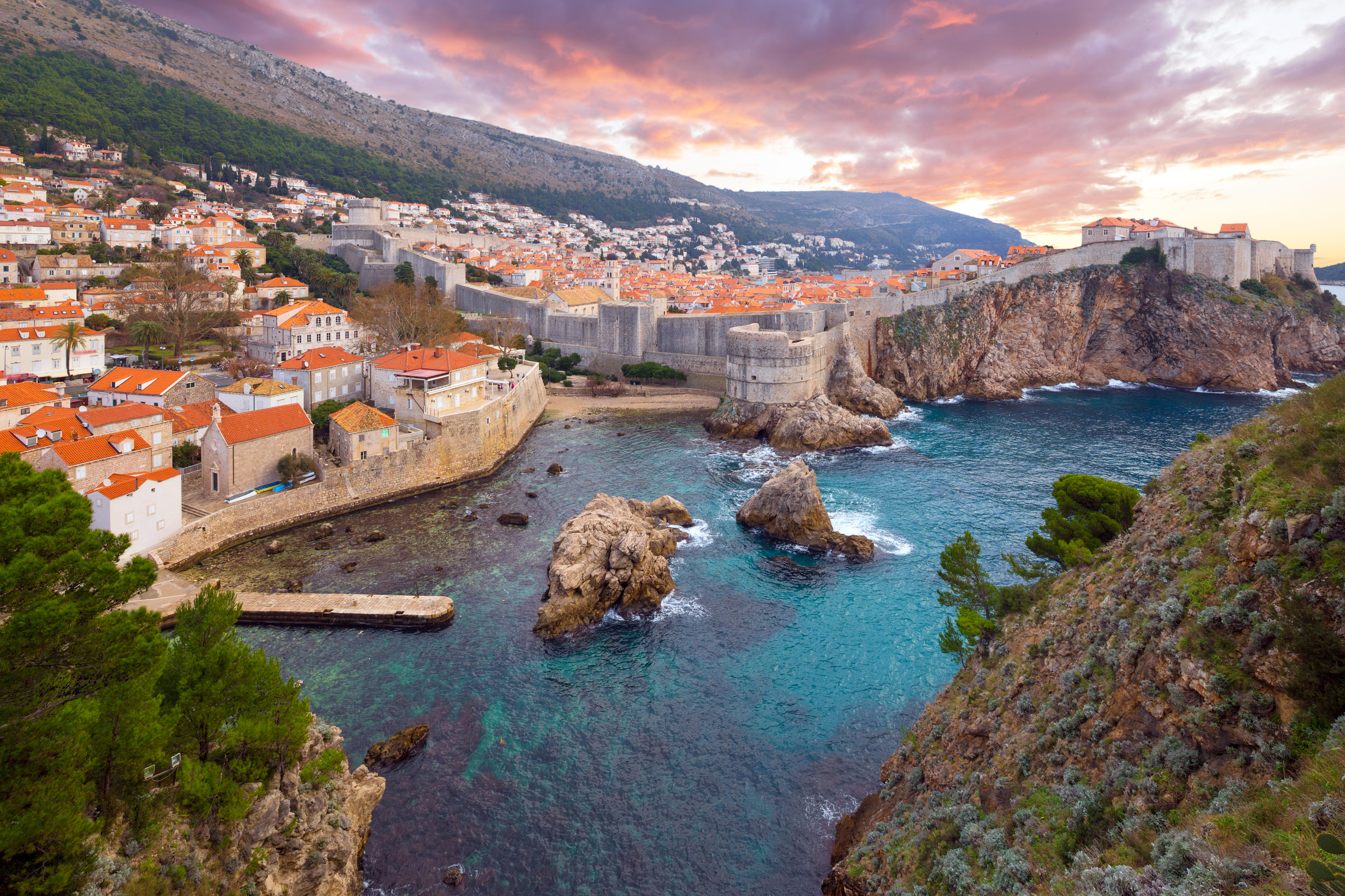 Ancient ruins overlooking the clear blue sea in the Mediterranean